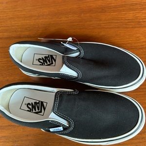Size 7 Black Slip on Vans.